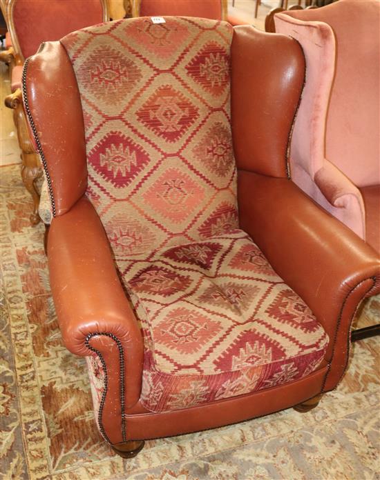 A leather and upholstered armchair